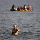 Image for article titled Syrian refugees celebrate a risky journey to Greece with an amazing selfie-stick photo